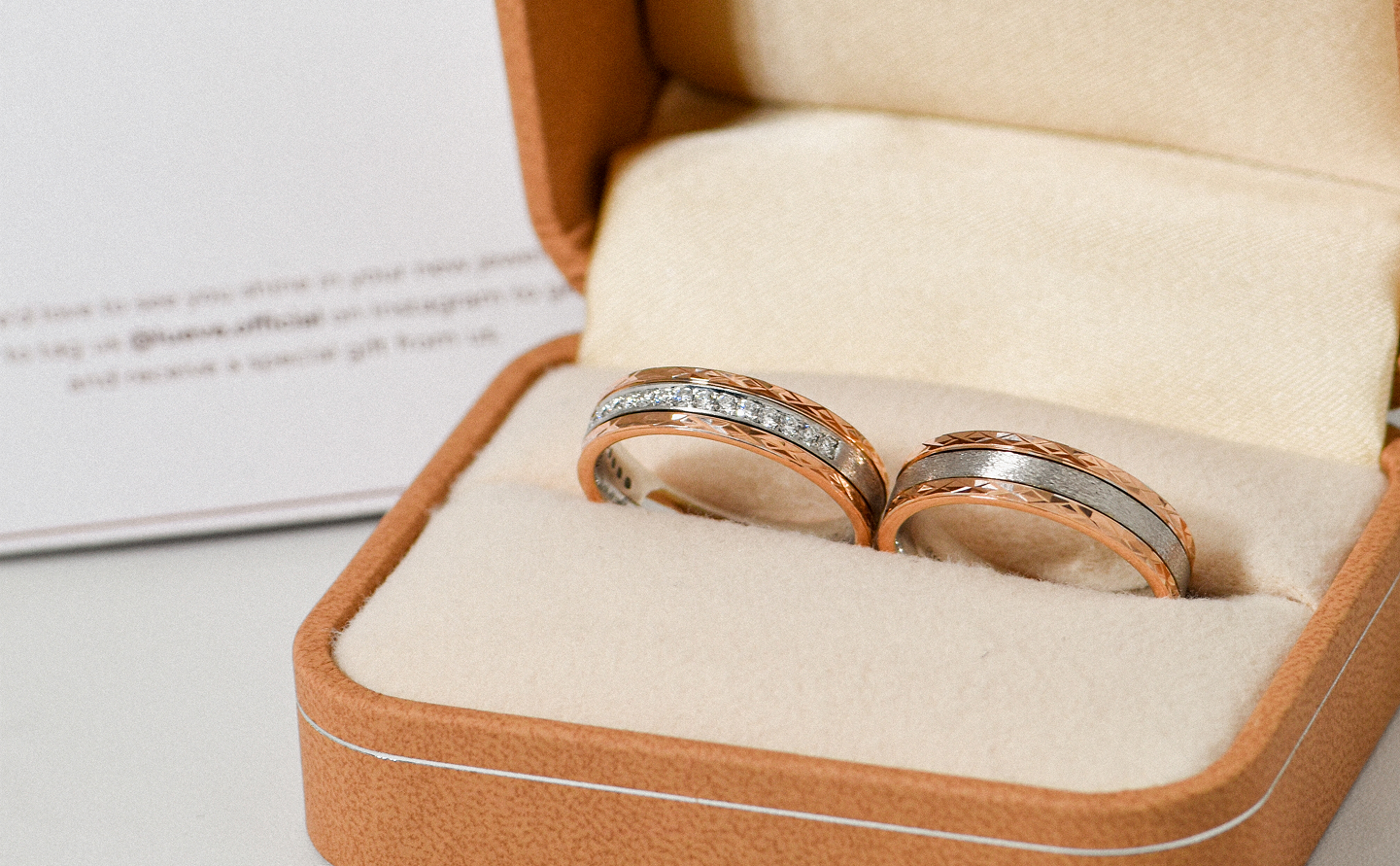 Wedding rings on paper background